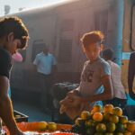 indian railway hawkers selling fruits on railway station