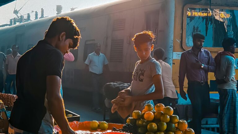 indian railway hawkers selling fruits on railway station